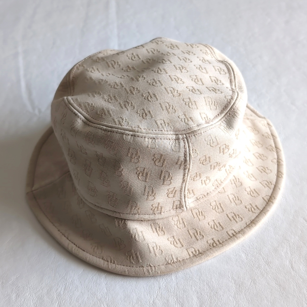 Dooney and Bourke Cream Colored All-over Print Bucket Hat